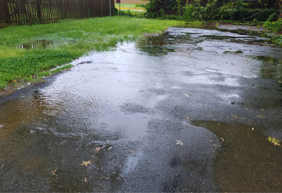Puddles on asphalt driveway